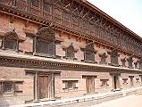 Kathmandu Bhaktapur 03-1 Bhaktapur Durbar Square Palace Of 55 Windows The Palace of 55 Windows in Bhaktapurs Durbar Square is actually the east wing of the Royal Palace, constructed in the 17C of red brick and featuring 55 black, artfully-carved wooden windows.